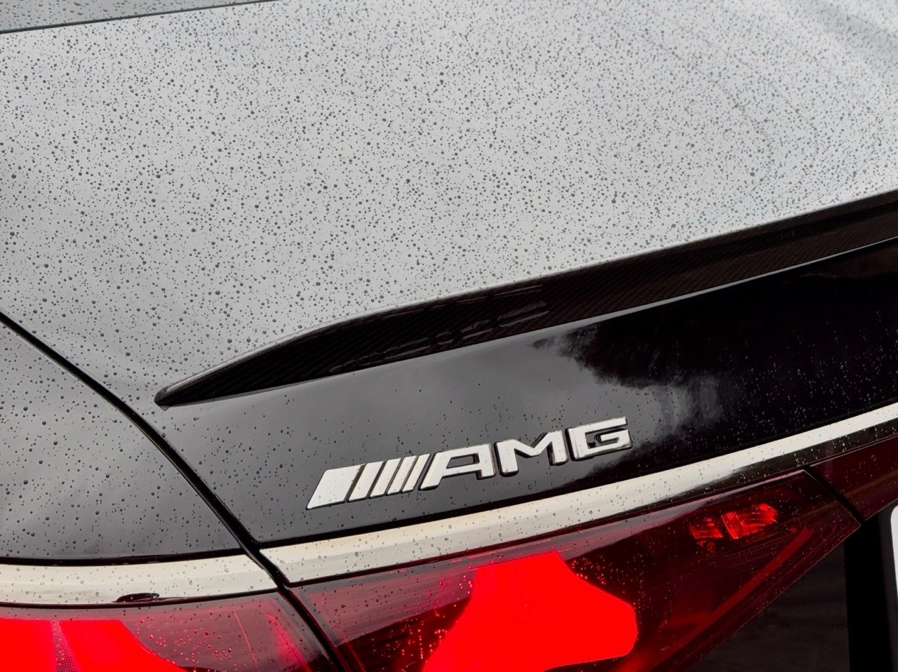 Mercedes AMG badge with water beading on paint